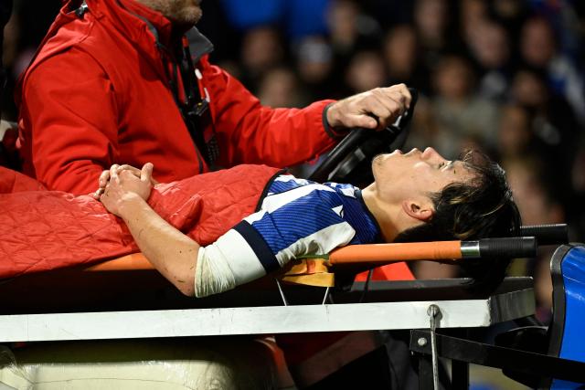 Real Sociedad's Japanese forward #14 Takefusa Kubo is carried on a stretcher off the pitch after resulting injured during the Spanish league football match between Real Sociedad and FC Barcelona at Anoeta Stadium in San Sebastian on January 18, 2026. (Photo by ANDER GILLENEA / AFP)