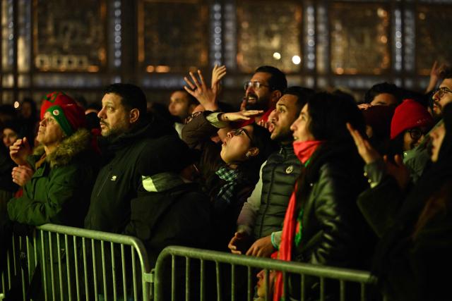 Supporters react as they watch the Africa Cup of Nations (CAN) final football match between Senegal and Morocco on a giant screen in front of the Arab Institute in Paris on January 18, 2026. (Photo by Martin LELIEVRE / AFP)