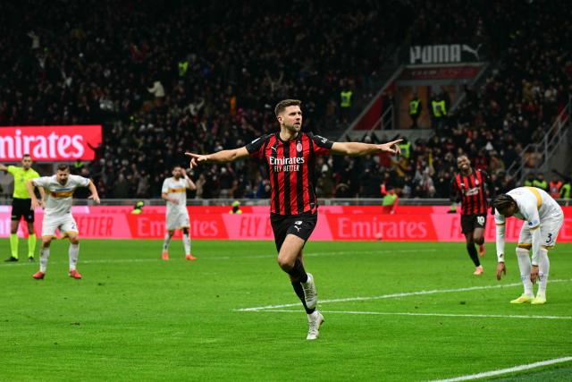 AC Milan's German forward #09 Niclas Fullkrug celebrates scoring his team's first goal during the Italian Serie A football match between AC Milan and Lecce at San Siro stadium in Milan, northern Italy, on January 18, 2026. (Photo by Stefano RELLANDINI / AFP)