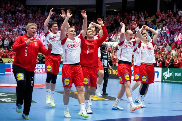 Denmark's players celebrate the victory with the fans after the men's EHF Euro 2026 preliminary round group B handball match Romania vs Denmark in Herning, Denmark, on January 18, 2026. (Photo by Bo Amstrup / Ritzau Scanpix / AFP) / Denmark OUT