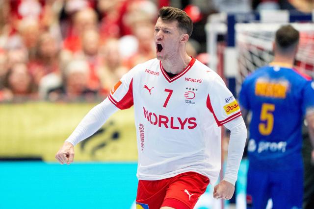 Denmark's wing #07 Emil Manfeldt Jakobsen reacts after scoring during the men's EHF Euro 2026 preliminary round group B handball match Romania vs Denmark in Herning, Denmark, on January 18, 2026. (Photo by Bo Amstrup / Ritzau Scanpix / AFP) / Denmark OUT