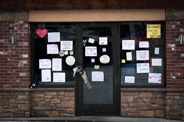 Messages of support can be seen on January 18, 2026 on the front door of a Mexican restaurant in White Bear Lake, Minnesota that has remained temporarily closed after US Immigration and Customs Enforcement (ICE) agents descended on the area. Well wishers have left good will messages at the front door of the very popular restaurant in the small city near Minneapolis, Minnesota. (Photo by ROBERTO SCHMIDT / AFP)