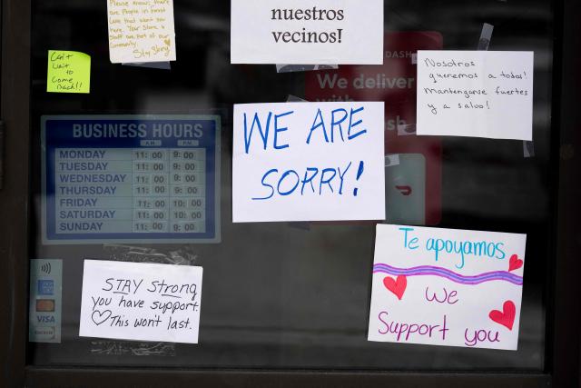 Messages of support can be seen on January 18, 2026 on the front door of a Mexican restaurant in White Bear Lake, Minnesota that has remained temporarily closed after US Immigration and Customs Enforcement (ICE) agents descended on the area. Well wishers have left good will messages at the front door of the very popular restaurant in the small city near Minneapolis, Minnesota. (Photo by ROBERTO SCHMIDT / AFP)