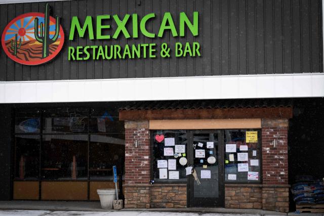 Messages of support can be seen on January 18, 2026 on the front door of a Mexican restaurant in White Bear Lake, Minnesota that has remained temporarily closed after US Immigration and Customs Enforcement (ICE) agents descended on the area. Well wishers have left good will messages at the front door of the very popular restaurant in the small city near Minneapolis, Minnesota. (Photo by ROBERTO SCHMIDT / AFP)