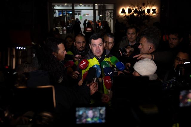 President of the Junta de Andalucia Juanma Moreno Bonilla attends to the media after a train accident in Adamuz, southern Spain, early on January 19, 2026. Spain reeled from a collision between two high-speed trains in the southern region of Andalusia that killed 21 people and injured more than 70, with the Prime Minister Pedro Sanchez lamenting a "night of deep pain" in the early hours of January 19, 2026. (Photo by Jorge GUERRERO / AFP)