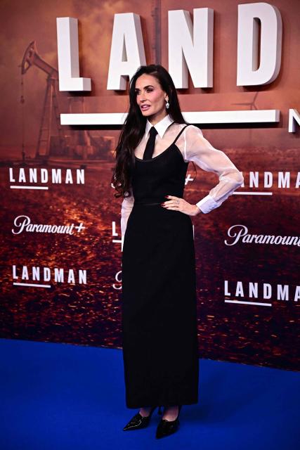 (FILES) US actress Demi Moore arrives on the red carpet for the European Premiere of the second season of the US drama television series "Landman" at the Zoo Palast cinema in Berlin on November 14, 2025. Nicole Kidman, Demi Moore, Bella Hadid... Actresses and models are unapologetically sporting ties, the quintessential male accessory, in a gesture that is gaining momentum at a time when women's rights are faltering in some countries. This long-standing male garment, so closely associated in our time with men in suits and the professional world, but which the pandemic left somewhat in the wardrobe, is once again being seen in women's looks. (Photo by Tobias SCHWARZ / AFP)
