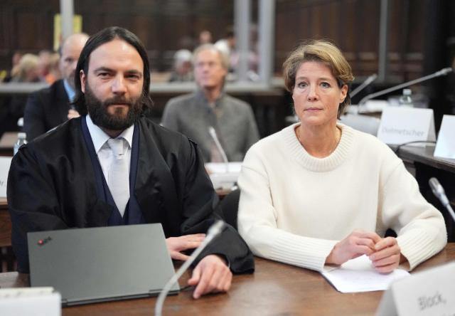 Defendant German entrepreneur and gastronome Christina Block (R) is seen next to her lawyer Ingo Bott as she waits for the continuation her trial over alleged child abduction at the District Court in Hamburg, northern Germany, on January 19, 2026. The public prosecutor's office accuses Block, heiress of a steakhouse chain, of ordering the abduction of her daughter, born in 2010, and her son, born in 2013. According to the indictment, the background to this is an escalating custody dispute over many years between Block and her former husband, who have four children together. (Photo by Marcus Brandt / POOL / AFP)