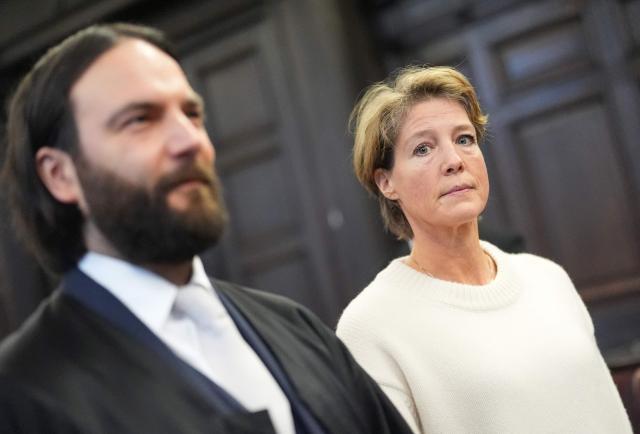 Defendant German entrepreneur and gastronome Christina Block (R) is seen next to her lawyer Ingo Bott as she waits for the continuation her trial over alleged child abduction at the District Court in Hamburg, northern Germany, on January 19, 2026. The public prosecutor's office accuses Block, heiress of a steakhouse chain, of ordering the abduction of her daughter, born in 2010, and her son, born in 2013. According to the indictment, the background to this is an escalating custody dispute over many years between Block and her former husband, who have four children together. (Photo by Marcus Brandt / POOL / AFP)