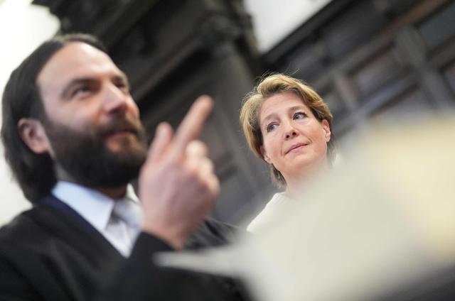 Defendant German entrepreneur and gastronome Christina Block (R) is seen next to her lawyer Ingo Bott as she waits for the continuation her trial over alleged child abduction at the District Court in Hamburg, northern Germany, on January 19, 2026. The public prosecutor's office accuses Block, heiress of a steakhouse chain, of ordering the abduction of her daughter, born in 2010, and her son, born in 2013. According to the indictment, the background to this is an escalating custody dispute over many years between Block and her former husband, who have four children together. (Photo by Marcus Brandt / POOL / AFP)