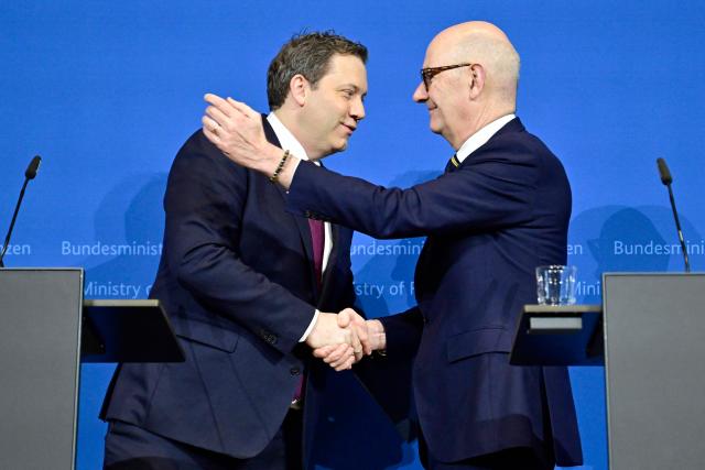 German Finance Minister and Vice Chancellor Lars Klingbeil (L) and French Minister of the Economy, Finance, and Industrial, Energy, and Digital Sovereignty Roland Lescure shake hands after giving a statement on January 19, 2026 in Berlin. (Photo by John MACDOUGALL / AFP)