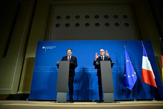 German Finance Minister and Vice Chancellor Lars Klingbeil (L) and French Minister of the Economy, Finance, and Industrial, Energy, and Digital Sovereignty Roland Lescure give a joint statement on January 19, 2026 in Berlin. (Photo by John MACDOUGALL / AFP)