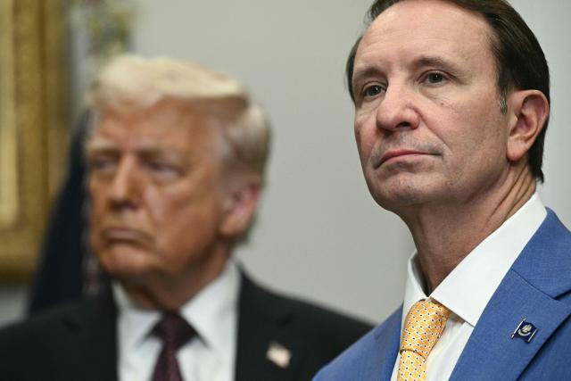(FILES) US President Donald Trump (L) and then Louisiana Governor Jeff Landry attend an event with Hyundai executives in the Roosevelt Room of the White House in Washington, DC, March 24, 2025. Greenland's dogsled federation said on January 19, 2026 that the new US special envoy to the Arctic island had been disinvited to its annual race, as Washington repeatedly threatens to take over the autonomous Danish territory. Jeff Landry had been invited to attend the race by a private Greenlandic tour operator, an invite the KNQK federation has previously called "totally inappropriate". (Photo by Brendan SMIALOWSKI / AFP)