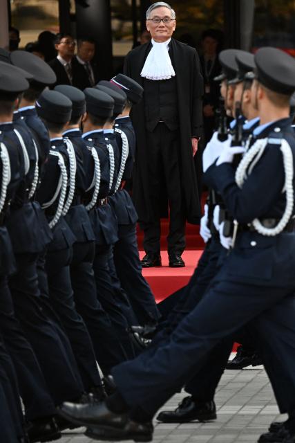 Hong Kong Chief Justice Andrew Cheung (C) inspects a guard of honour during a ceremony held to mark the opening of the legal year in Hong Kong on January 19, 2026. (Photo by Peter PARKS / AFP)