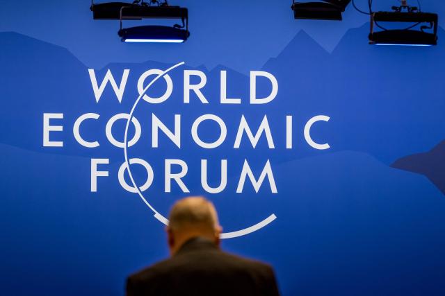 EDITORS NOTE: Graphic content / A sign of the World Economic Forum (WEF) is seen at the Congress Centre on its opening day in Davos on January 19, 2026. The World Economic Forum takes place in Davos from January 19 to January 23, 2026. (Photo by Fabrice COFFRINI / AFP)