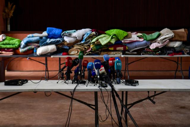 Microphones are placed before a news conference near the site where a high-speed Iryo train derailed and was hit by another train as rescue efforts continue in Adamuz, southern Spain, on January 19, 2026. At least 39 people died and more than 120 injured in the deadliest train accident in Spain in over a decade.
The crash happened on Sunday evening when a train operated by rail company Iryo travelling from Malaga to Madrid derailed near Adamuz, crossing onto the other track where it crashed into an oncoming train, which also derailed. (Photo by CRISTINA QUICLER / AFP)