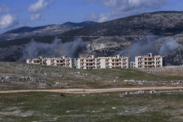 Smoke rises from the site of an Israeli airstrike that targeted a valley on the outskirts of the southern Lebanese village of Bourghos on January 19, 2026. Israel's army said it carried out several strikes against Hezbollah infrastructure in southern Lebanon on January 19, 2026, despite Lebanon this month announcing progress in disarming the militia as it continues to launch regular strikes in the area even after a ceasefire was agreed with Hezbollah in November 2024 to end more than a year of hostilities. (Photo by Rabih DAHER / AFP)