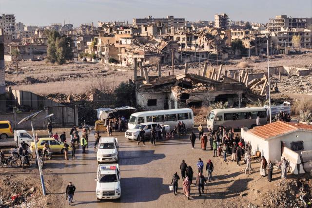 Syrian government forces deploy in the province of Deir Ezzor, eastern Syria on January 19, 2026, the day after an agreement between the Syrian government and the Kurdish forces. In Deir Ezzor, an AFP correspondent saw dozens of military vehicles heading to the east of the Euphrates river, which once separated Damascus-controlled areas to the west from the US-backed, Kurdish-led Syrian Democratic Forces (SDF) to the east. After two days of rapid gains in Kurdish-controlled territory, the Syrian President announced on Januray 18, a deal with the Kurdish SDF leader that includes a ceasefire and the integration of the Kurdish administration and forces into the central state. (Photo by OMAR HAJ KADOUR / AFP)