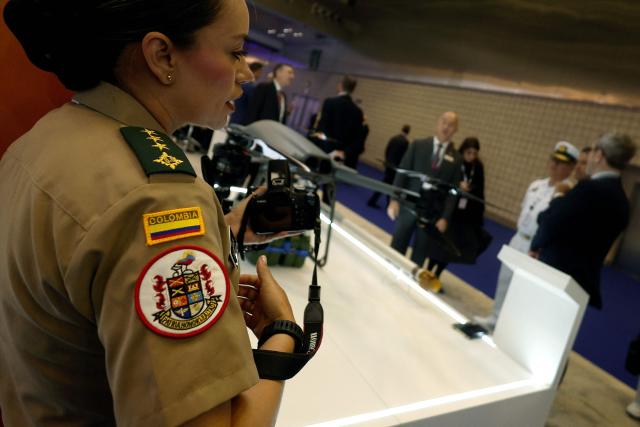 A member of the Colombia delegation visits the Doha International Maritime Defence Exhibition and Conference (DIMDEX 2026) which showcases technology, maritime, and defence capabilities, at the Qatar National Convention Centre, in Doha on January 19, 2026. (Photo by Karim JAAFAR / AFP)