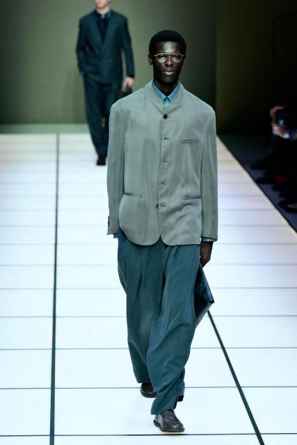 A model walks the runway during the Giorgio Armani collection show at Milan's Fashion Week Menswear Fall/Winter 2026-2027, in Milan on January 19, 2026. (Photo by Stefano RELLANDINI / AFP)