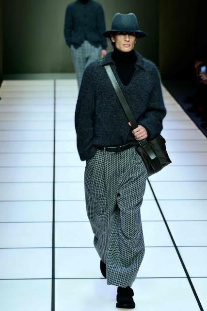 US model James Turlington walks the runway during the Giorgio Armani collection show at Milan's Fashion Week Menswear Fall/Winter 2026-2027, in Milan on January 19, 2026. (Photo by Stefano RELLANDINI / AFP)