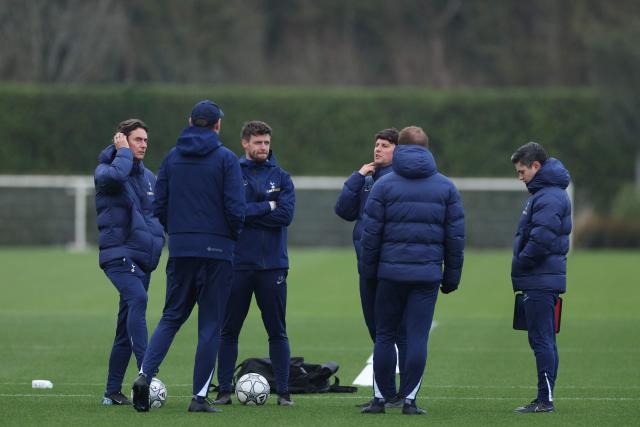 Tottenham Hotspur's Danish head coach Thomas Frank (L) chats with his assistants during a team training session at the Tottenham training centre in Enfield, north London, on January 19, 2026, the eve of their UEFA Champions League league phase football match against Dortmund. (Photo by Adrian Dennis / AFP)