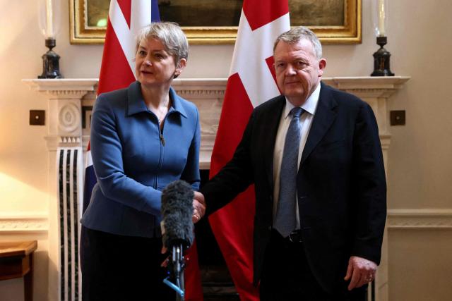 Britain's Foreign Secretary Yvette Cooper (L) and Denmark's Foreign Minister Lars Loekke Rasmussen shake hands as they meet at 1 Carlton Gardens in London on January 19, 2026. (Photo by Jack Taylor / POOL / AFP)