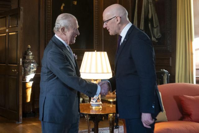 King Charles Britain's King Charles III shakes hands with First Minister of Scotland John Swinney during a reception at the Palace of Holyroodhouse, Edinburgh, on January 19, 2026, to mark the Scotland Investment Forum. (Photo by Jane Barlow / POOL / AFP)