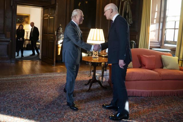 King Charles Britain's King Charles III shakes hands with First Minister of Scotland John Swinney during a reception at the Palace of Holyroodhouse, Edinburgh, on January 19, 2026, to mark the Scotland Investment Forum. (Photo by Jane Barlow / POOL / AFP)
