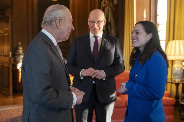 King Charles Britain's King Charles III (L) speaks with and Deputy First Minister Kate Forbes (R) as the First Minister of Scotland John Swinney (C) looks on during a reception at the Palace of Holyroodhouse, Edinburgh, on January 19, 2026, to mark the Scotland Investment Forum. (Photo by Jane Barlow / POOL / AFP)