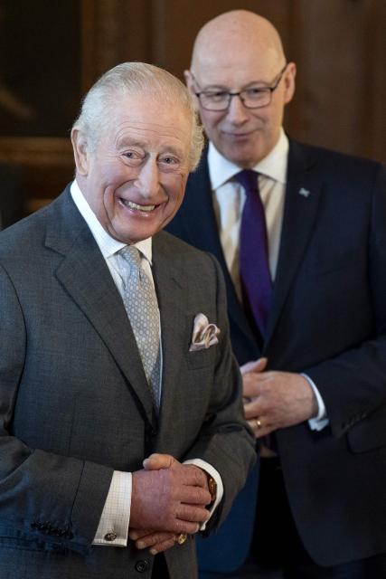 King Charles Britain's King Charles III speaks with the First Minister of Scotland John Swinney during a reception at the Palace of Holyroodhouse, Edinburgh, on January 19, 2026, to mark the Scotland Investment Forum. (Photo by Jane Barlow / POOL / AFP)
