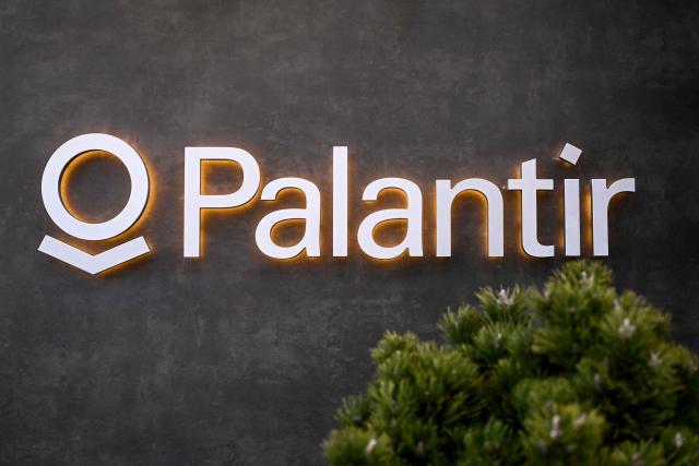 This photograph shows the logo of US big data analytics software company Palantir Technologies during the World Economic Forum (WEF) annual meeting in Davos on January 19, 2026. The World Economic Forum takes place in Davos from January 19 to January 23, 2026. (Photo by INA FASSBENDER / AFP)