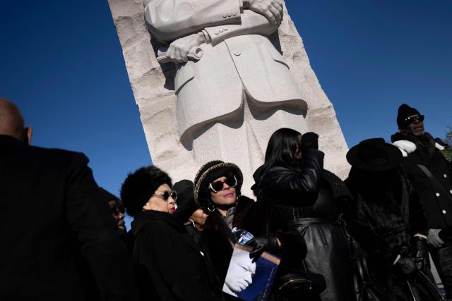 People leave after a celebration of Martin Luther King Jr. Day at the Martin Luther King, Jr. Memorial on the National Mall on January 19, 2026, in Washington, DC. (Photo by Brendan Smialowski / AFP)