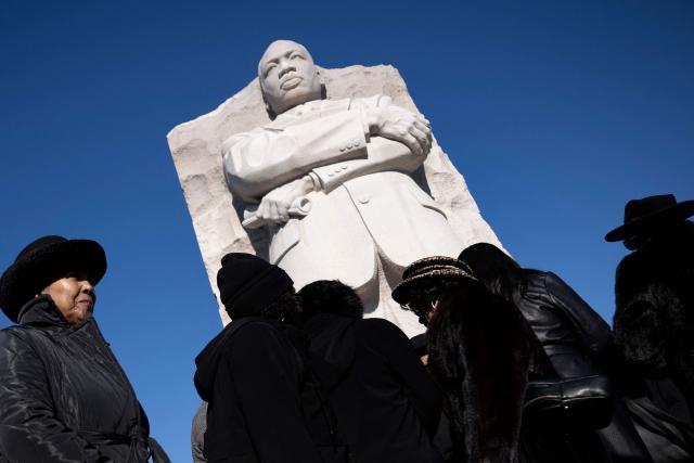 People leave after a celebration of Martin Luther King Jr. Day at the Martin Luther King, Jr. Memorial on the National Mall on January 19, 2026 in Washington, DC. (Photo by Brendan Smialowski / AFP)