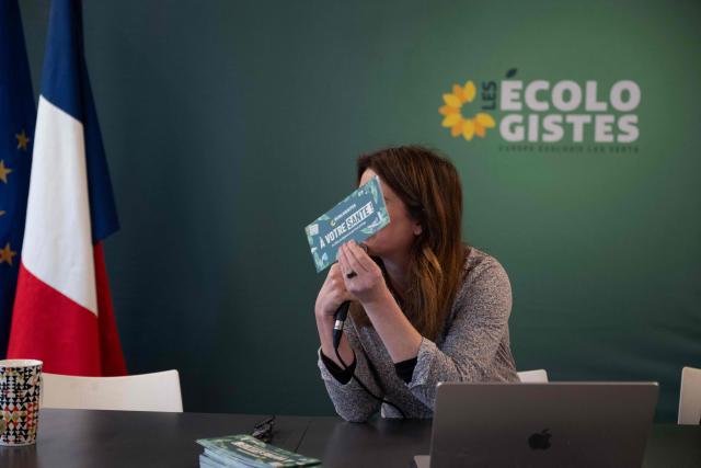 National secretary of French green party Les Ecologistes (EELV) Marine Tondelier holds up a health brochure as she delivers her New Year wishes to the press at the Maison de l'Amérique Latine in Paris, on January 19, 2026. (Photo by Blanca CRUZ / AFP)