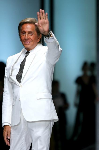 (FILES) Italian haute couture designer Valentino acknowledges the applause after his fashion show to mark 45 years in business, in Rome on July 7, 2007. Italian designer Valentino Garavani has died at age 93, Italy's ANSA news agency reported on January 19, 2026.  The giant in the world of haute couture died at his home in Rome, the agency reported, citing the Valentino Garavani Foundation and the designer's longtime partner, Giancarlo Giammetti. (Photo by Filippo MONTEFORTE / AFP)