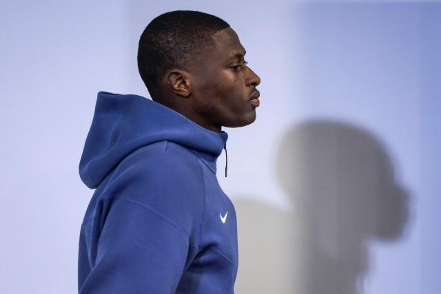 Paris SG’s Portuguese defender #25 Nuno Mendes arrives for a press conference on the eve of the UEFA Champions League league phase day 7 football match between Sporting CP and Paris SG at Alvalade stadium in Lisbon, on January 19, 2026. (Photo by PATRICIA DE MELO MOREIRA / AFP)