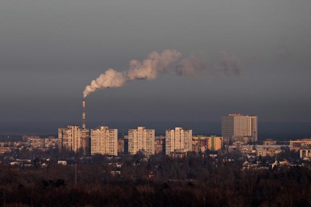 This photograph taken on January 19, 2026 shows steam rising from a chimney above a residential area in Kyiv, amid the Russian invasion of Ukraine. (Photo by Sergei GAPON / AFP)