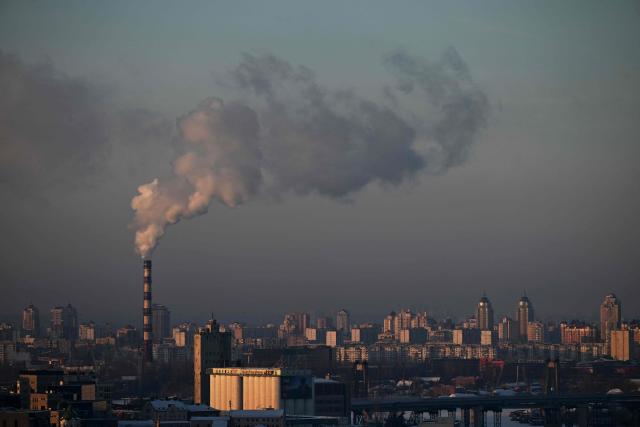 This photograph taken on January 19, 2026 shows steam rising from a chimney above a residential area in Kyiv, amid the Russian invasion of Ukraine. (Photo by Sergei GAPON / AFP)