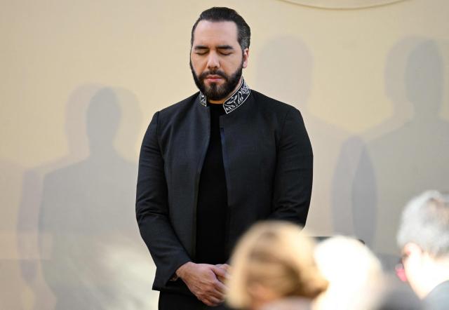 El Salvador’s President Nayib Bukele prays during the First National Prayer Breakfast for El Salvador at the National Palace in San Salvador on January 19, 2026. (Photo by Marvin RECINOS / AFP)