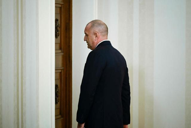 Bulgaria's President Rumen Radev leaves the press conference after announcing his resignation in Sofia on January 19, 2026. The Balkan country, which introduced the euro on January 1, was plunged into fresh political turmoil after a series of widespread anti-corruption protests swept a conservative-led government from office in mid-December. (Photo by Nikolay DOYCHINOV / AFP)