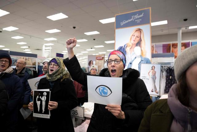 A small crowd of protesters sing along during a sit-in in a Target store as they denounce what they say is complicity by the store to allow Immigration and Customs Enforcement (ICE) agents to come into the store and stage in their parking lot in Saint Paul, Minnesota, on January 19, 2026. A US judge restricted federal agents on January 16 from interfering with peaceful protesters in Minnesota, after President Donald Trump said there was no immediate need to invoke the Insurrection Act over the demonstrations. (Photo by ROBERTO SCHMIDT / AFP)
