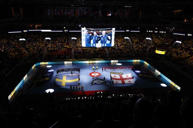 Sweden and Geogia"s teams line up for the national anthems before the men's EHF Euro 2026 preliminary round group E handball match Georgia v Sweden in Malmoe, Sweden, on January 19, 2026. (Photo by Andreas Hillergren/TT / TT NEWS AGENCY / AFP) / Sweden OUT