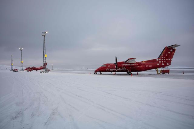 Air Greenland aircraft are pictured at Nuuk Airport in Nuuk, Greenland, on January 19, 2026. (Photo by Jonathan NACKSTRAND / AFP)