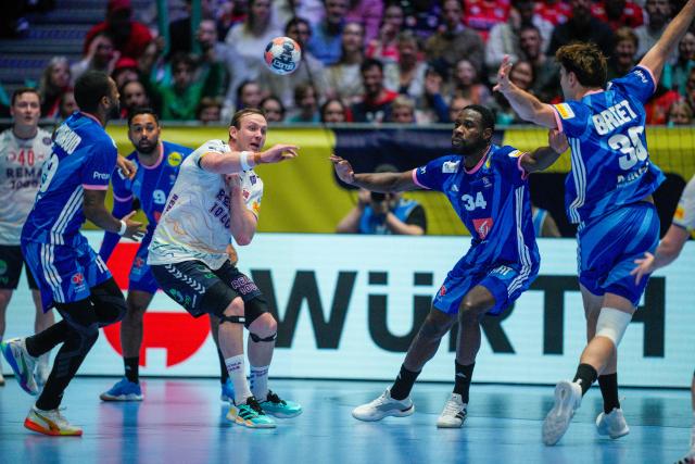 Norway's left back #05 Sander Sagosen and France's pivot #34 Karl Konan vie for the ball during the EHF Euro 2026 group C preliminary round handball match between France and Norway in Oslo, Norway, on January 19, 2026. (Photo by Stian Lysberg Solum / NTB / AFP) / Norway OUT