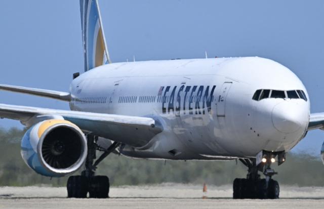 An Eastern Airlines plane carrying Venezuelan migrants deported from the United States lands at Simon Bolivar International Airport in Maiquetia, Venezuela on January 19, 2026. (Photo by Juan BARRETO / AFP)