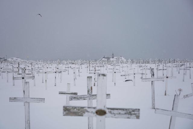 This image taken on January 19, 2026 shows the Nuuk cemetery during a snow fall in Nuuk, Greenland. (Photo by Jonathan NACKSTRAND / AFP)
