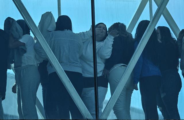 A Venezuelan migrant deported from the United States blows a kiss upon arrival at Simon Bolivar International Airport in Maiquetia, Venezuela on January 19, 2026. (Photo by Juan BARRETO / AFP)