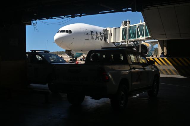 An Eastern Airlines plane carrying Venezuelan migrants deported from the United States lands at Simon Bolivar International Airport in Maiquetia, Venezuela on January 19, 2026. (Photo by Juan BARRETO / AFP)