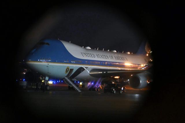 Air Force One, with US President Donald Trump aboard is pictured from inside an Osprey aircraft, as he departs from Palm Beach International Airport, in West Palm Beach, Florida on January 19, 2025. President Trump is on his way to attend the College Football National Championship Game between Miami Hurricanes and Indiana Hoosiers at Hard Rock Stadium in Miami Gardens, Florida. (Photo by ANDREW CABALLERO-REYNOLDS / AFP)