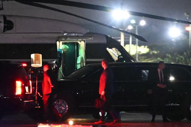 US President Donald Trump steps off Marine One after landing at North Perry Airport in Pembroke Pines to attend the College Football National Championship Game between the Miami Hurricanes and the Indiana Hoosiers at Hard Rock Stadium in Miami Gardens, Florida, on January 19, 2026. (Photo by ANDREW CABALLERO-REYNOLDS / AFP)